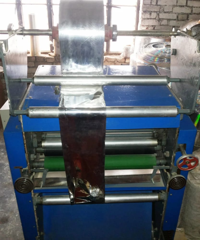Roll laminating machine running film at the Fotoset plant